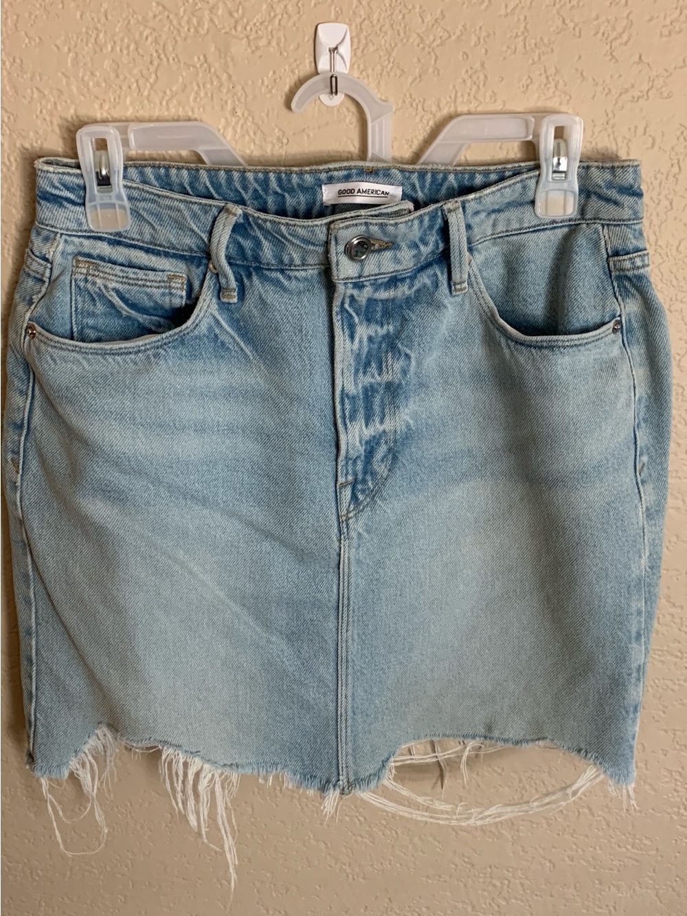 Good American Faded Blue Denim Mini Skirt with Frayed Hem